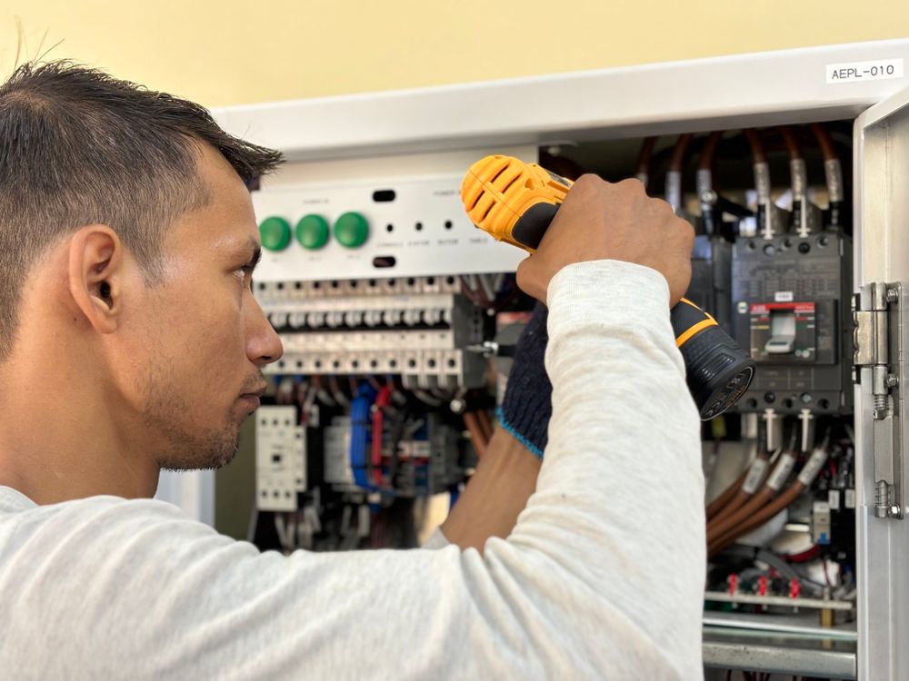 Residential electrician working on an electrical panel