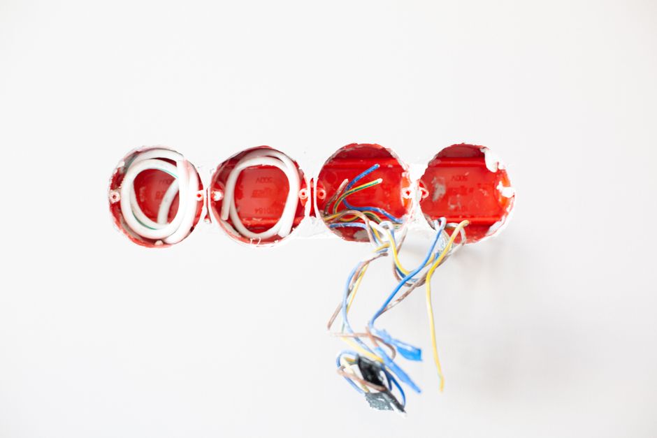 Commercial electrician working on complex business wiring